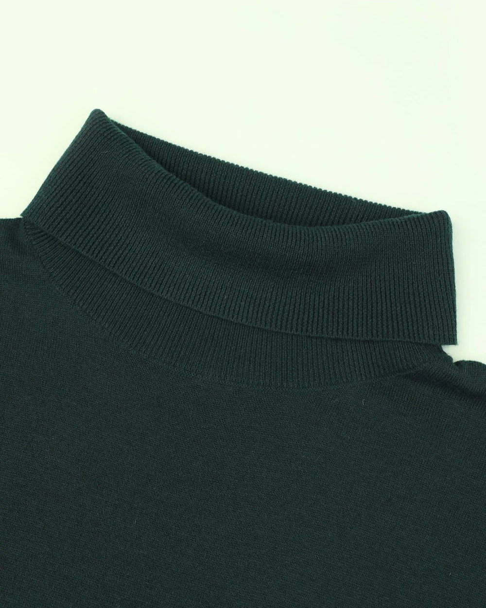 Close-up of a black turtleneck sweater collar on a white background