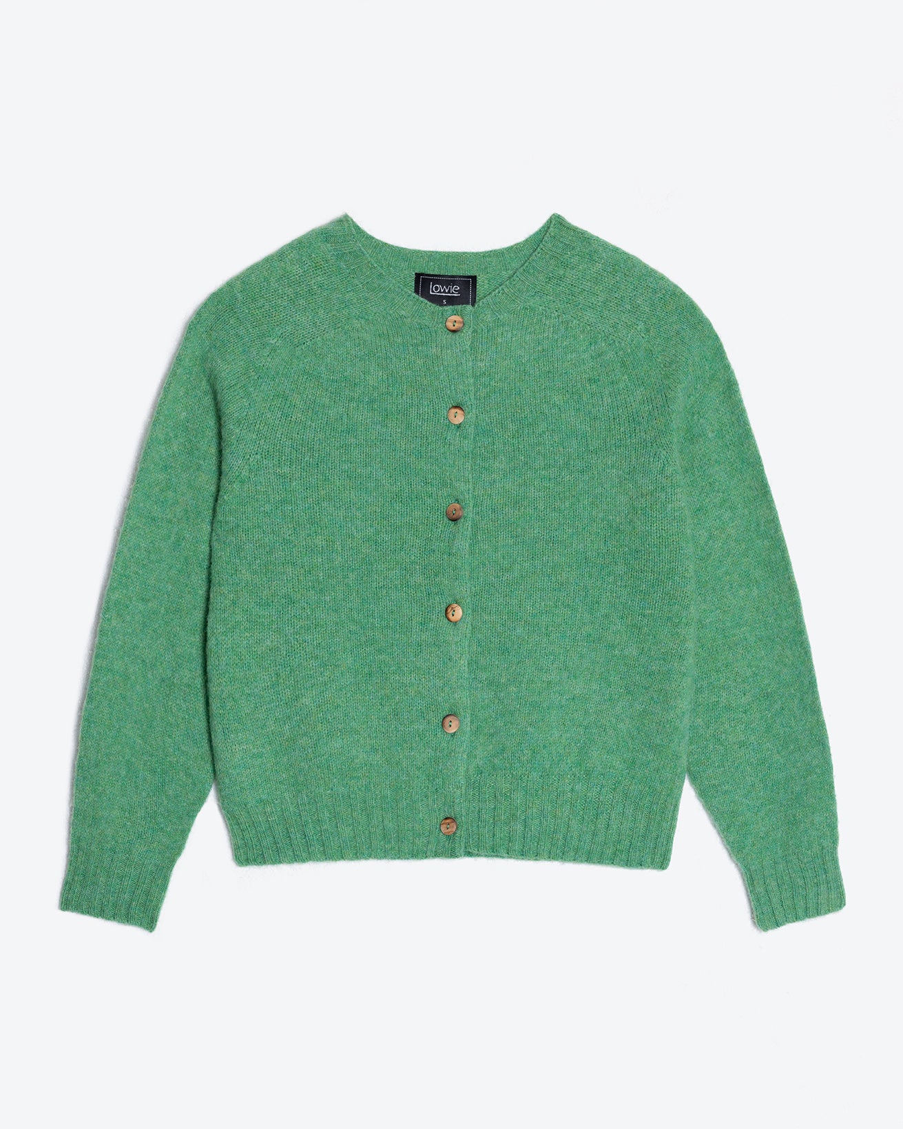 Green cardigan with brown buttons on a light gray background