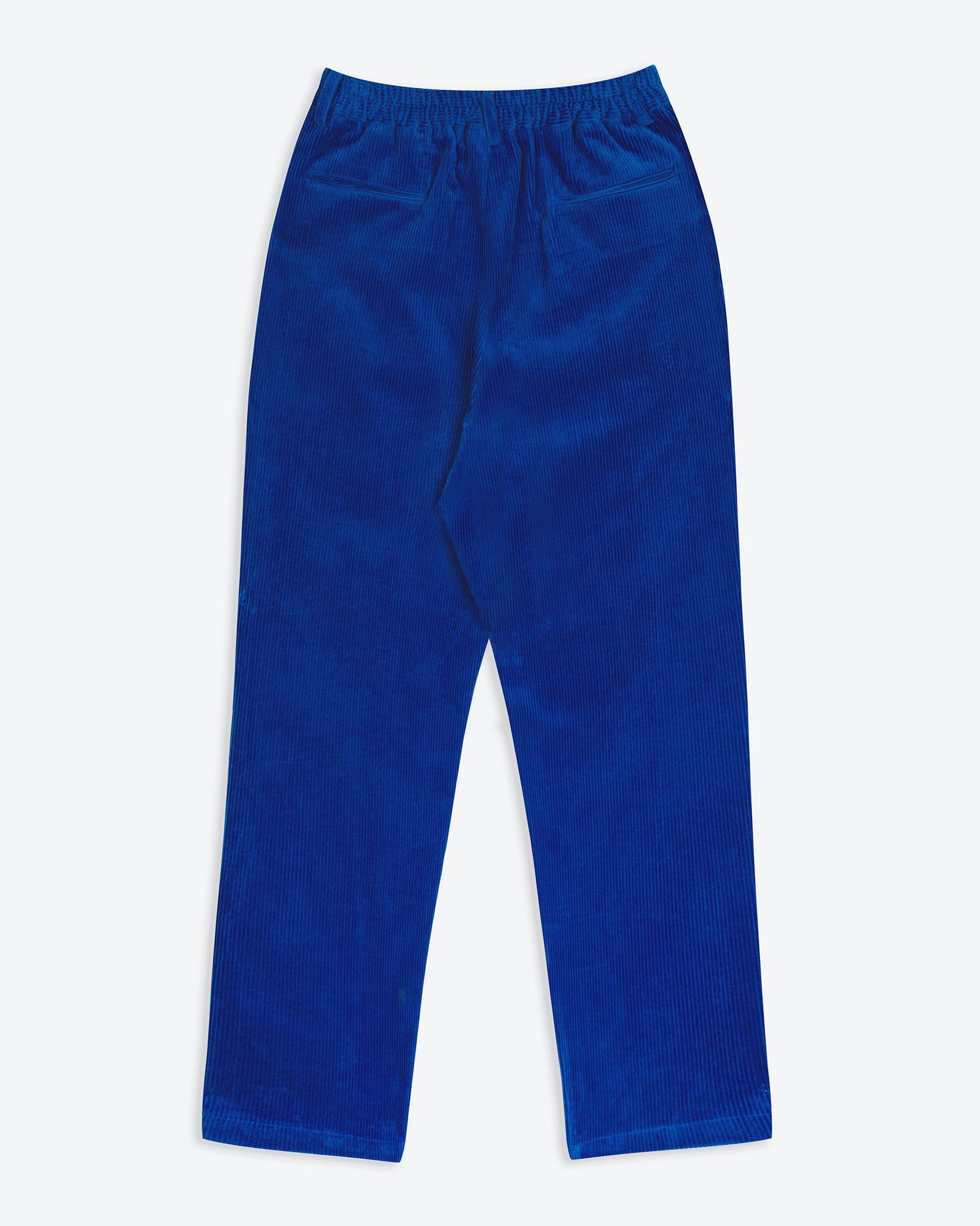A pair of electric cobalt blue corduroy easy trousers with a 4-pocket design, belt loops, pleats, and a tapered leg.