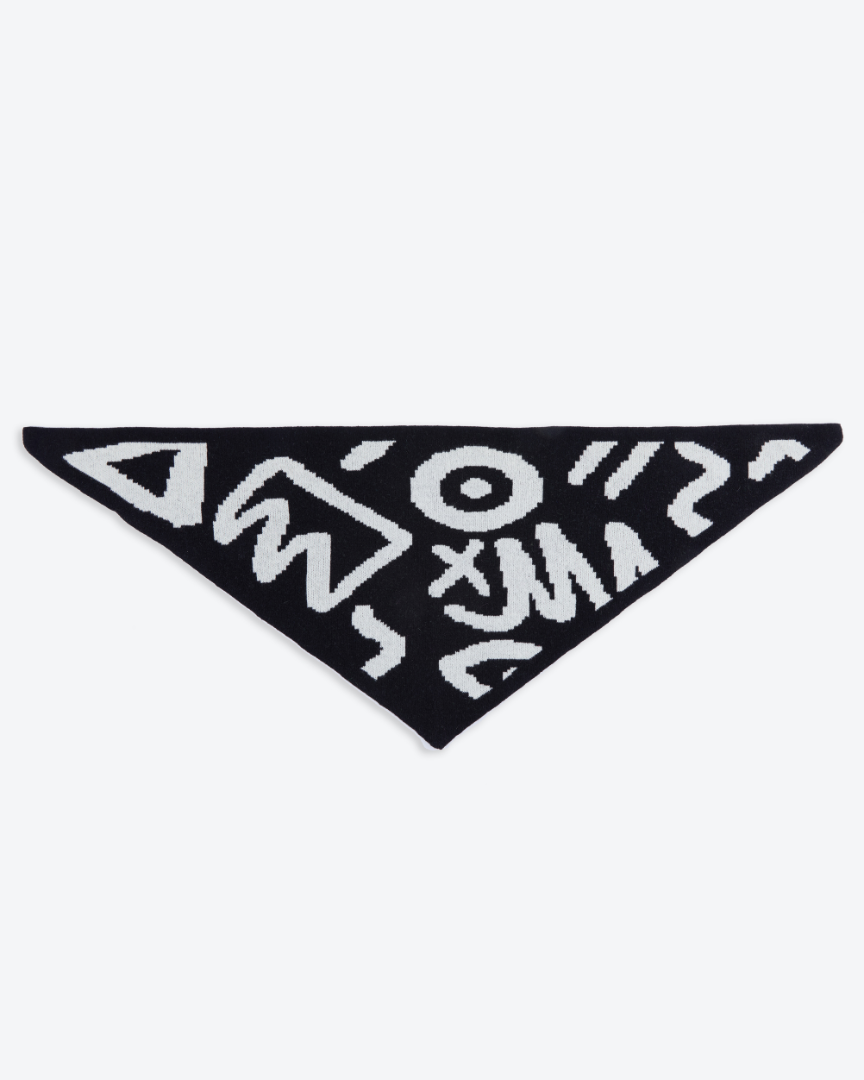 Black triangle-shaped patch with white geometric patterns on a white background