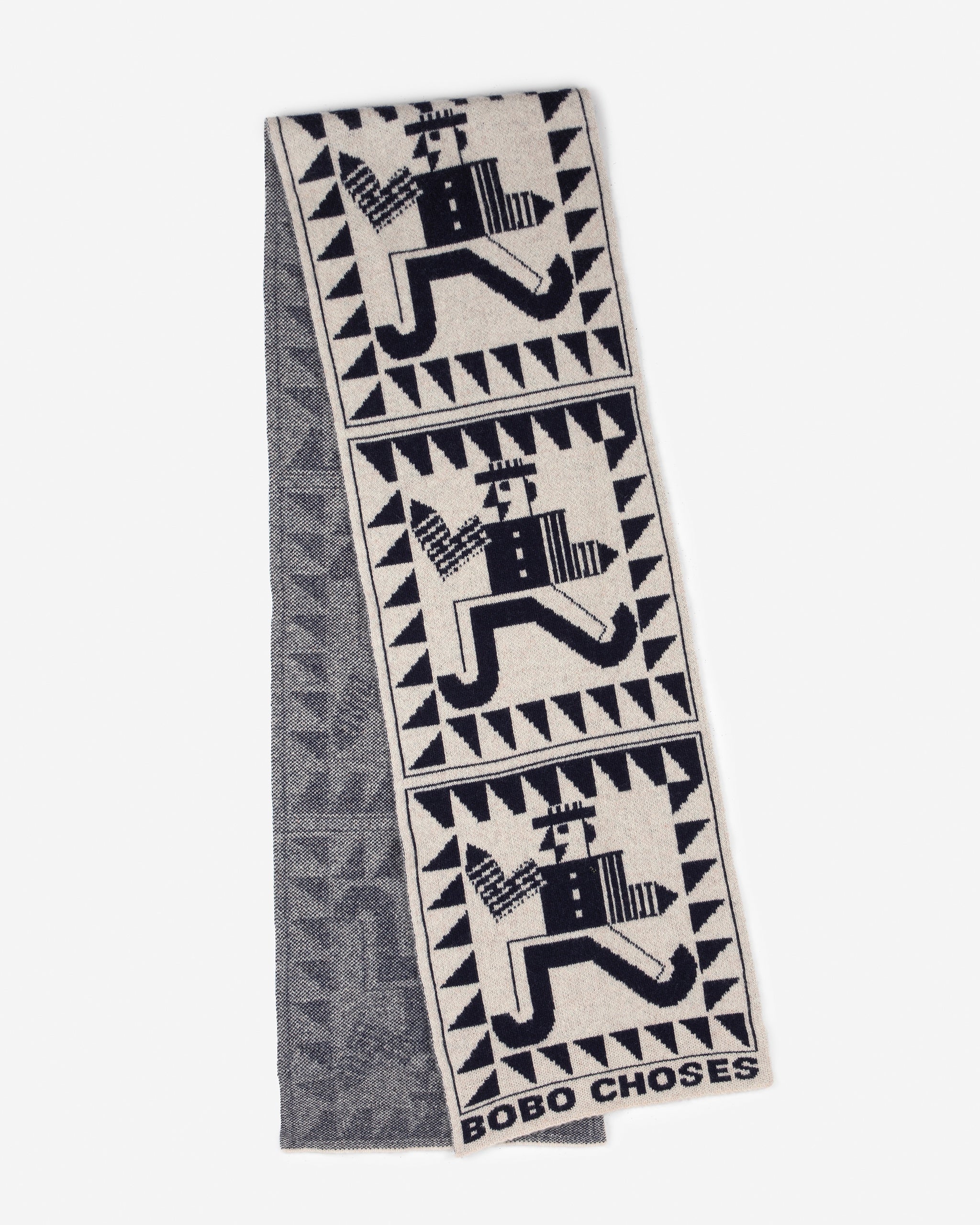 Textile with geometric patterns and 'Bobo Choses' branding on a white background