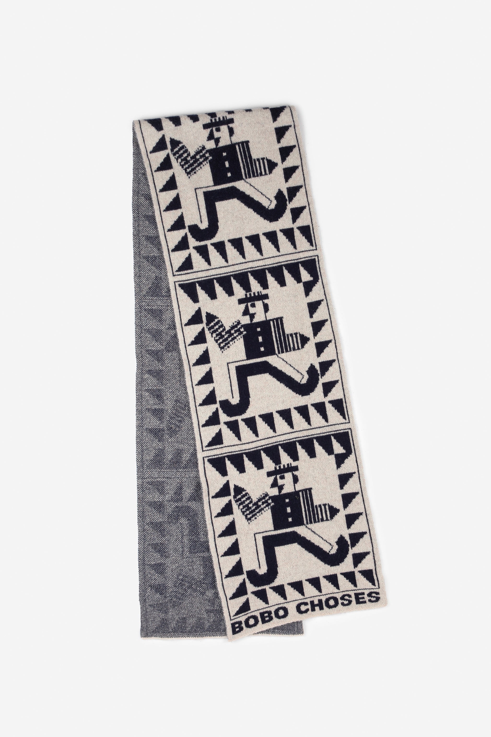 Textile with geometric patterns and 'Bobo Choses' branding on a white background