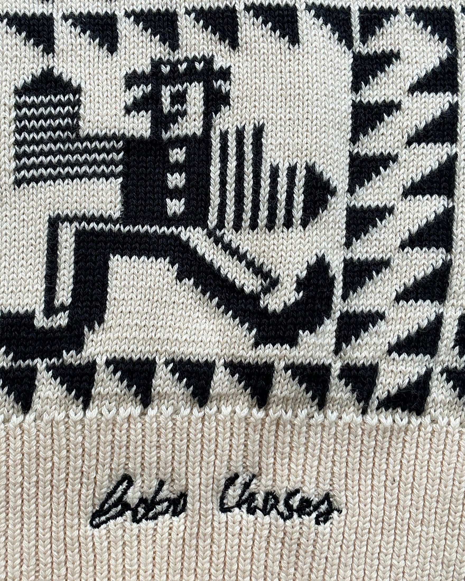 Textured fabric with black and white pattern and 'Bobo Choses' branding.