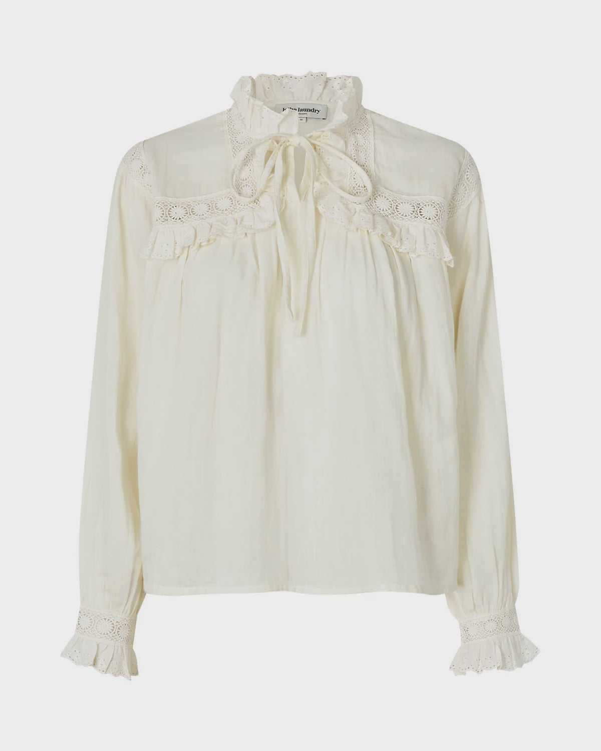 White blouse with lace details on a white background