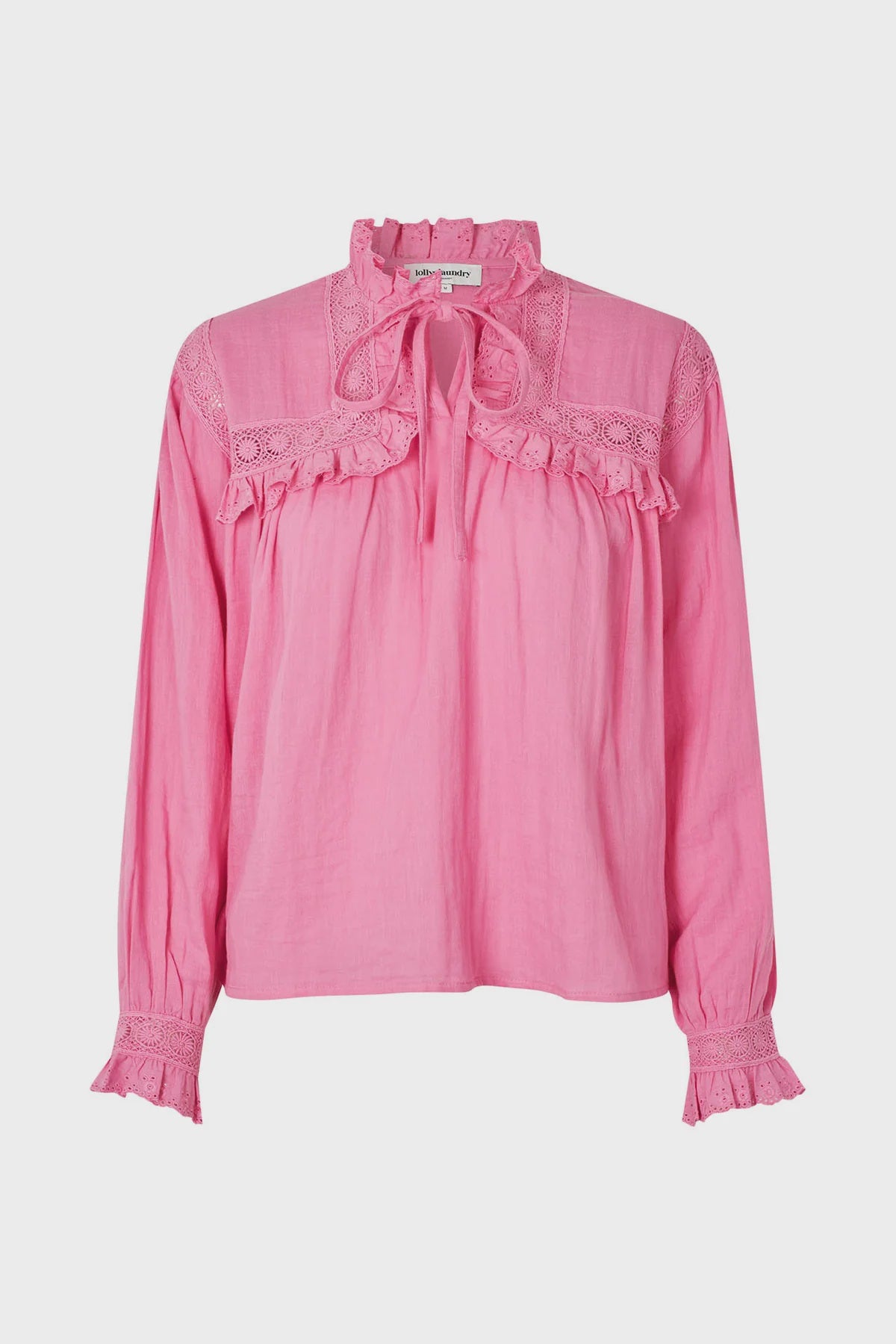 Pink blouse with lace details on a white background