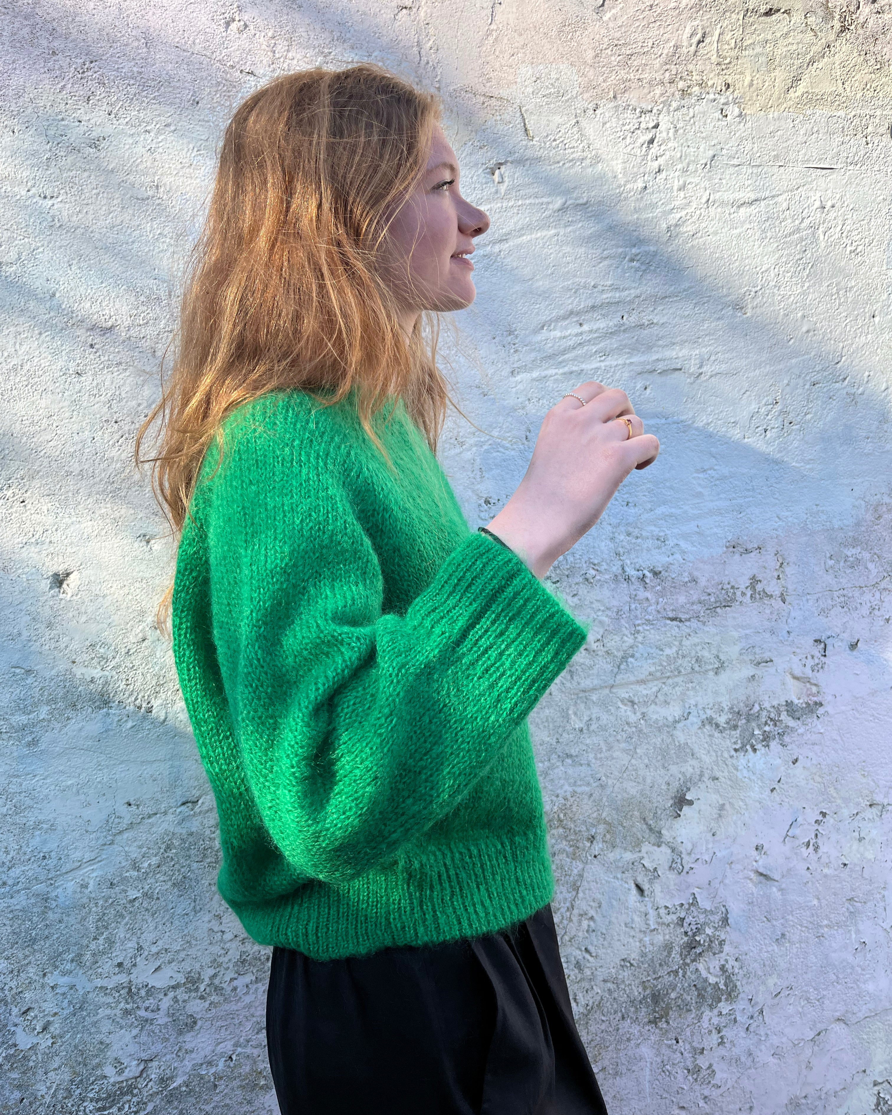 Person Wearing a bright green mohair jumper