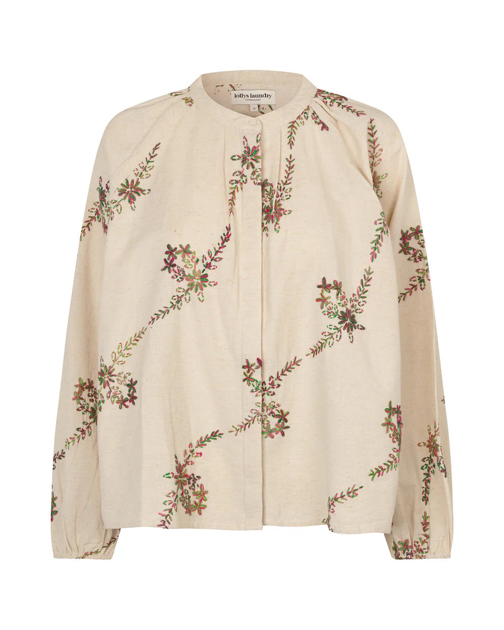 A cream-colored long-sleeve blouse with an all-over diagonal floral vine print in muted green, brown, and burgundy, shown against a plain white background.