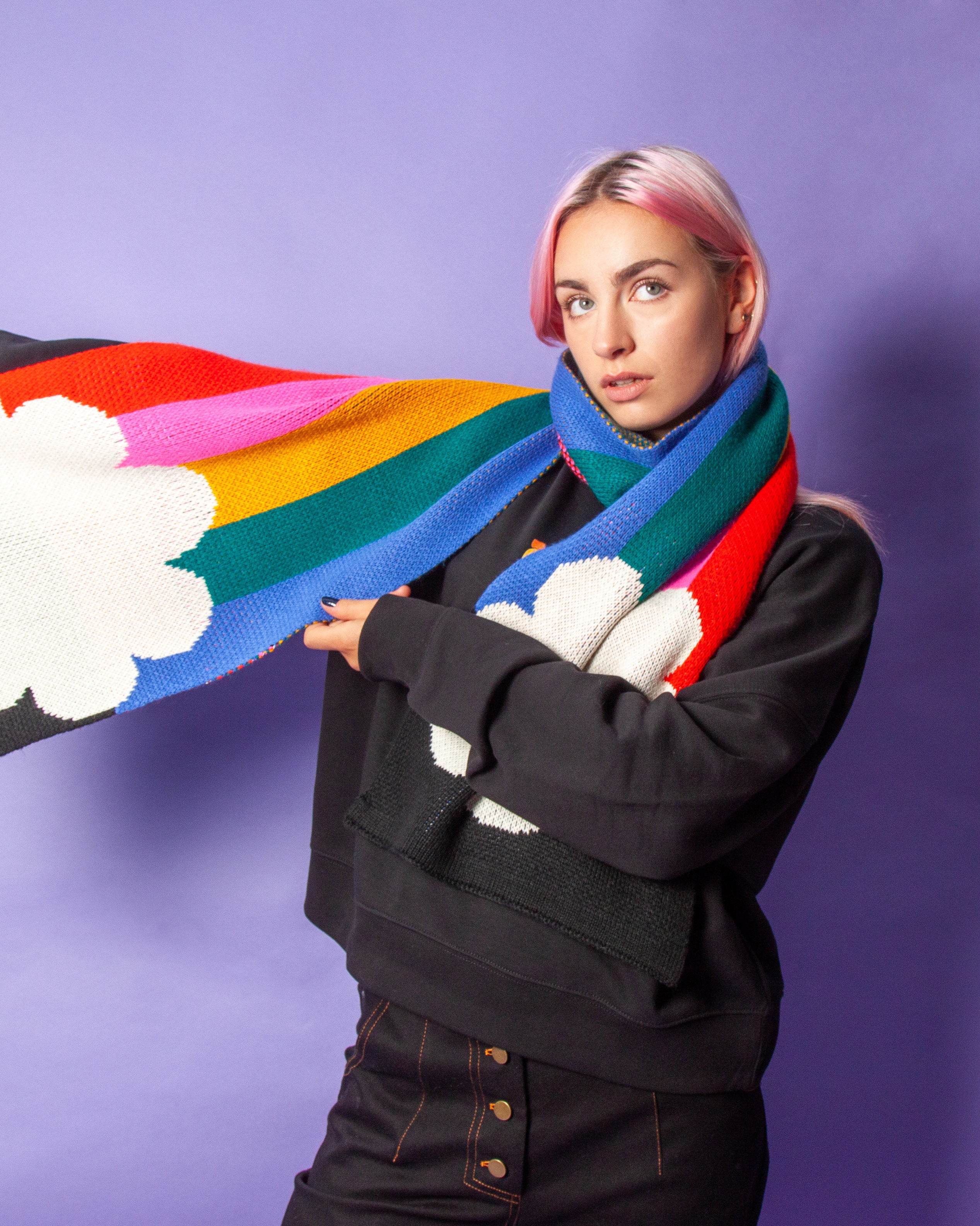 Person wearing a rainbow scarf