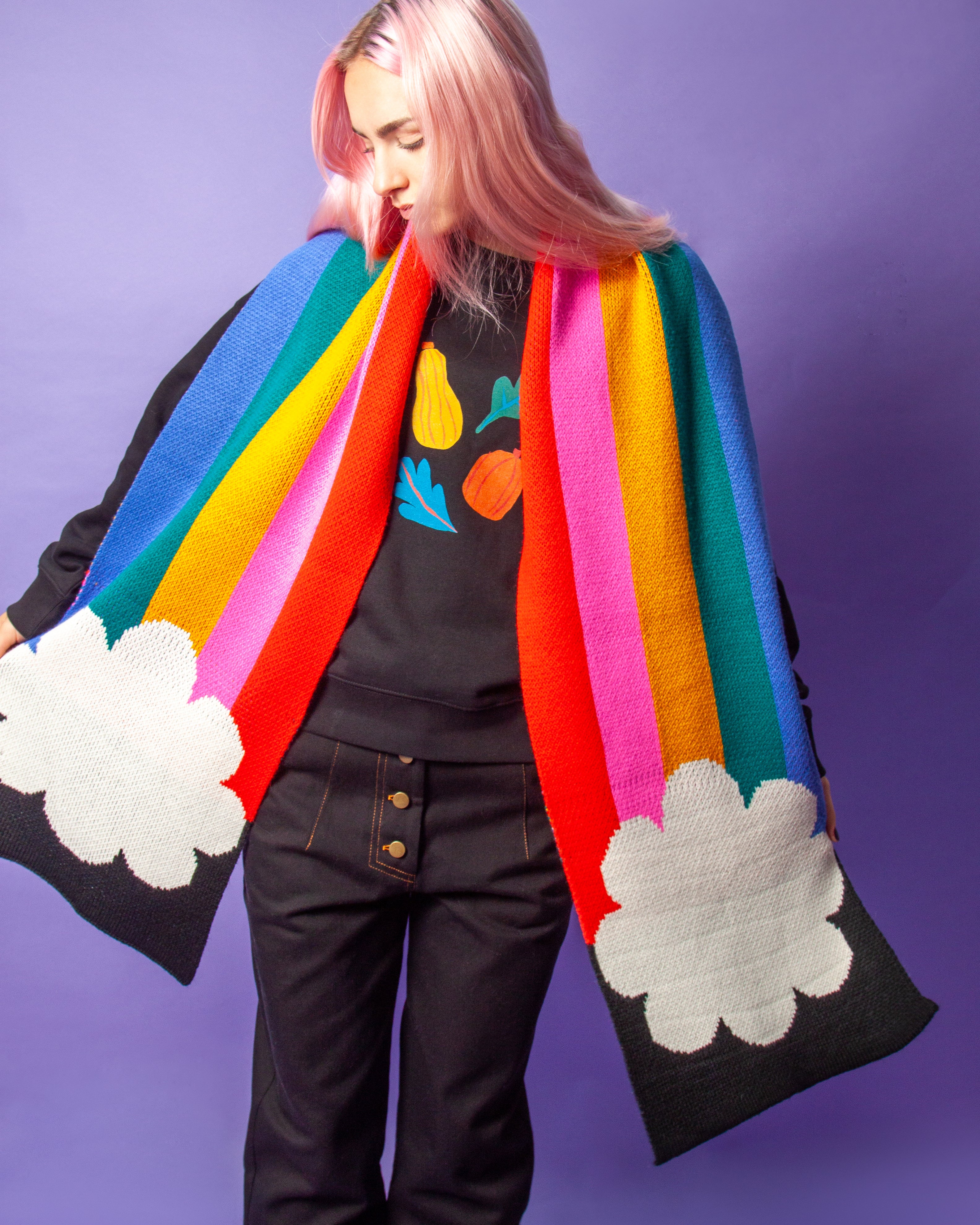 Person wearing a rainbow scarf