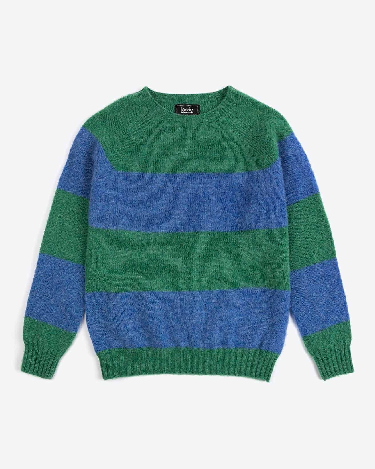 Green and blue striped sweater on a white background
