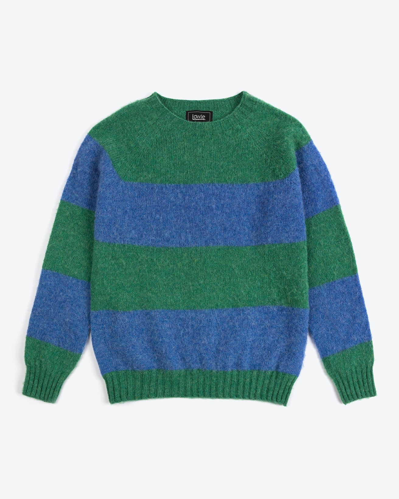Green and blue striped sweater on a white background