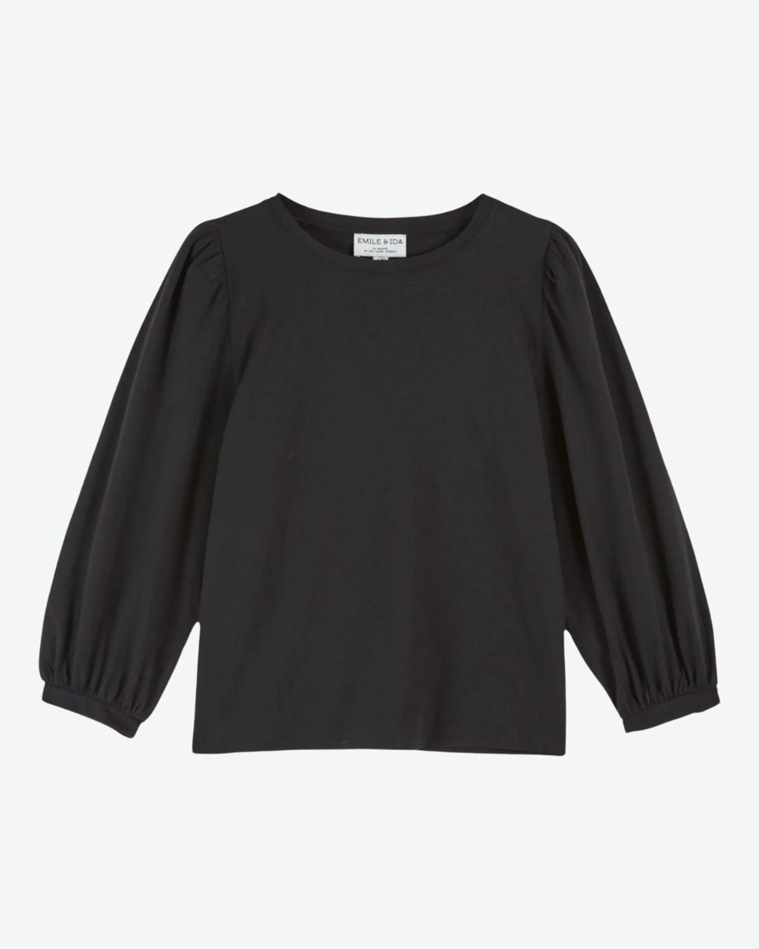 Black long-sleeve top on a light gray background