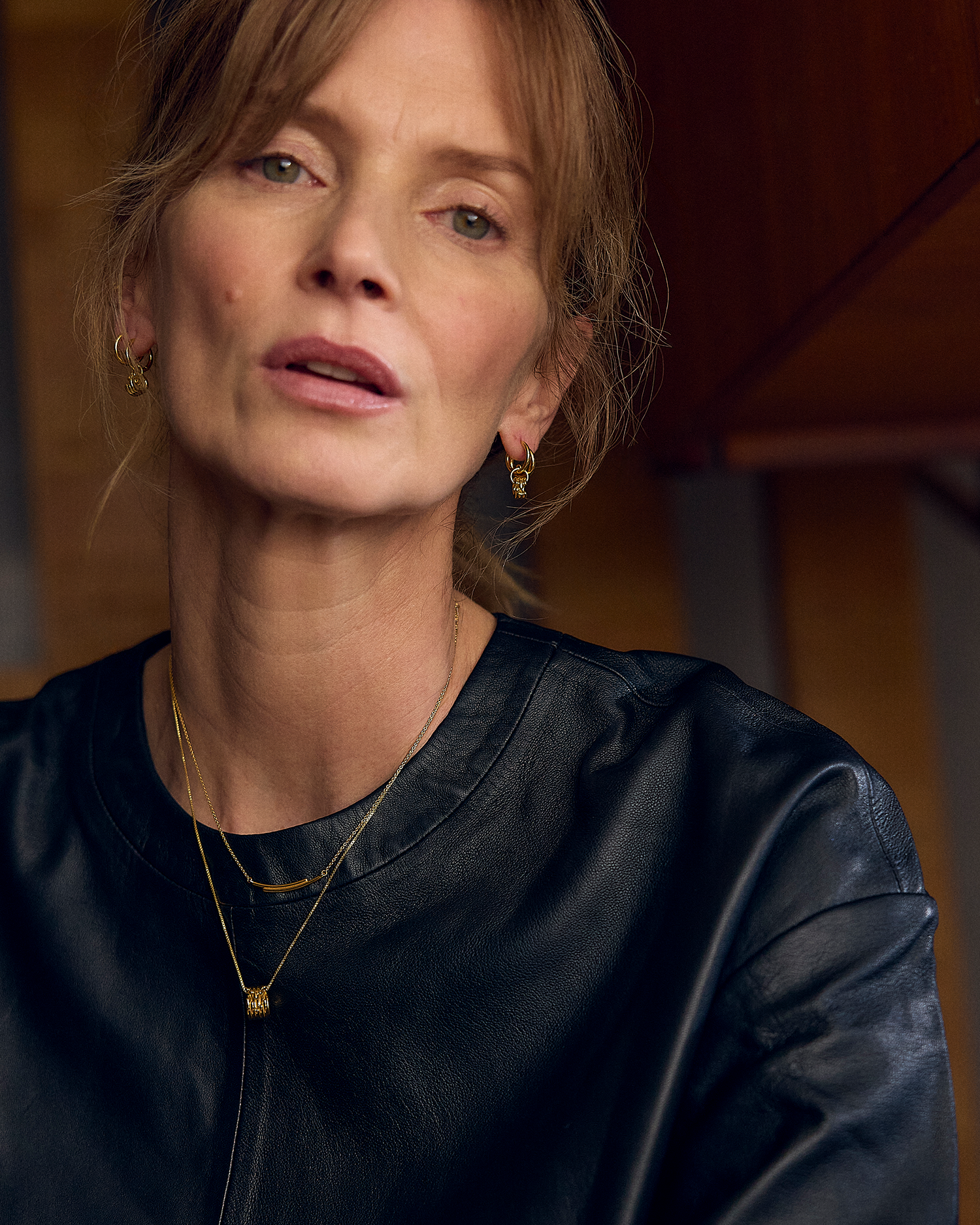 Woman wearing a black top with a blurred background