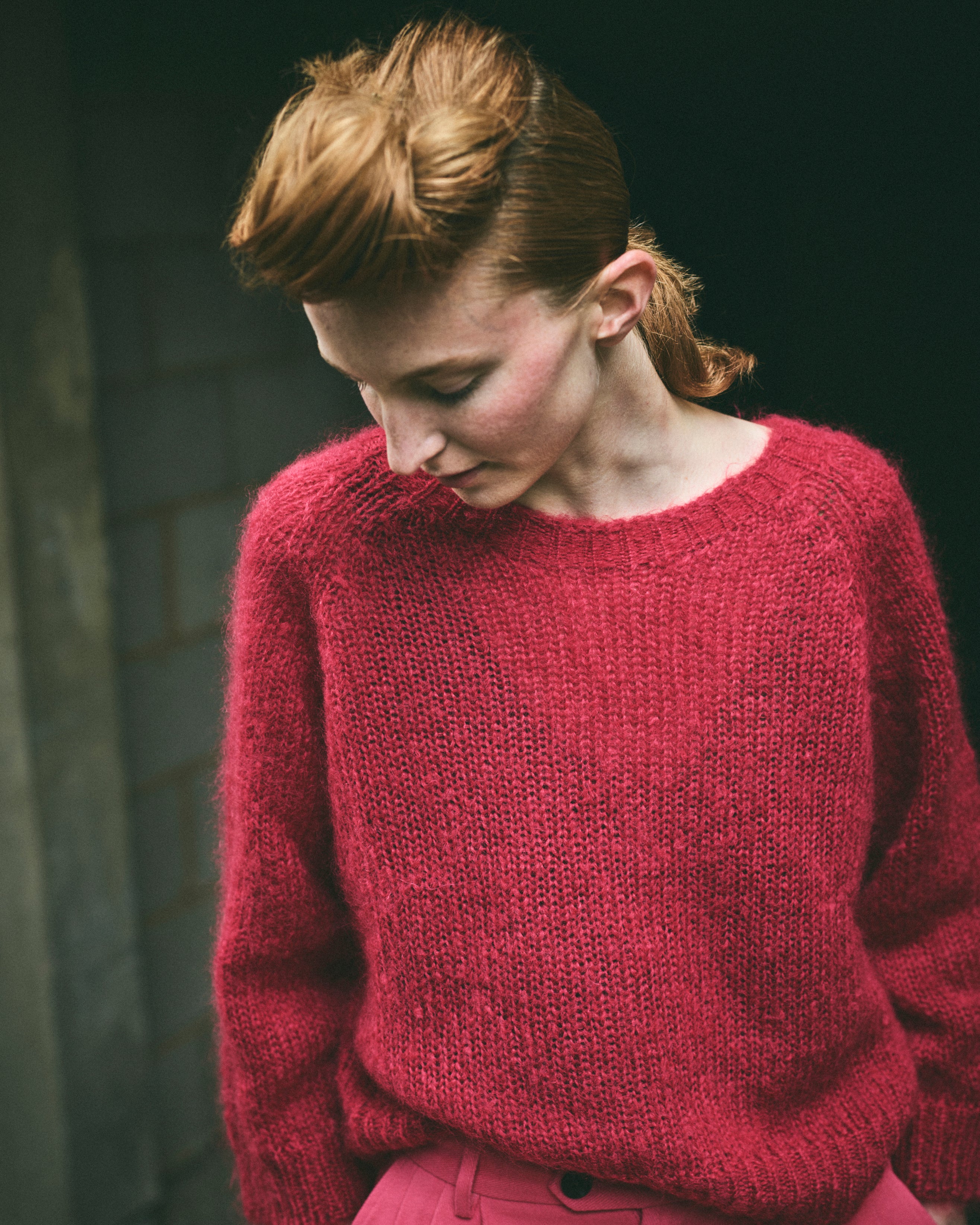 A cropped, bracelet sleeve, round neck red mohair jumper.