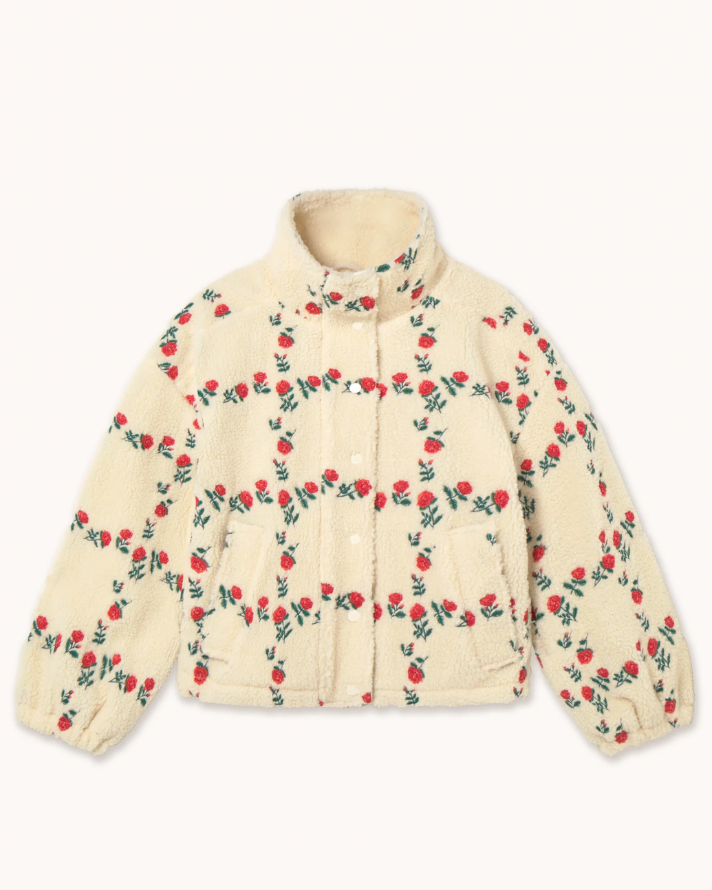 A cream-colored sherpa jacket with an all-over red rose and green vine pattern, displayed flat against a light off-white background.