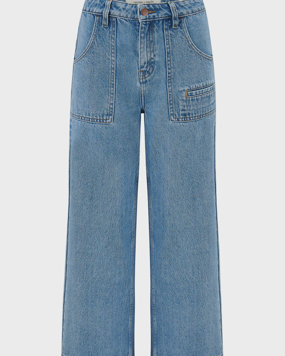 Blue jeans on a light gray background