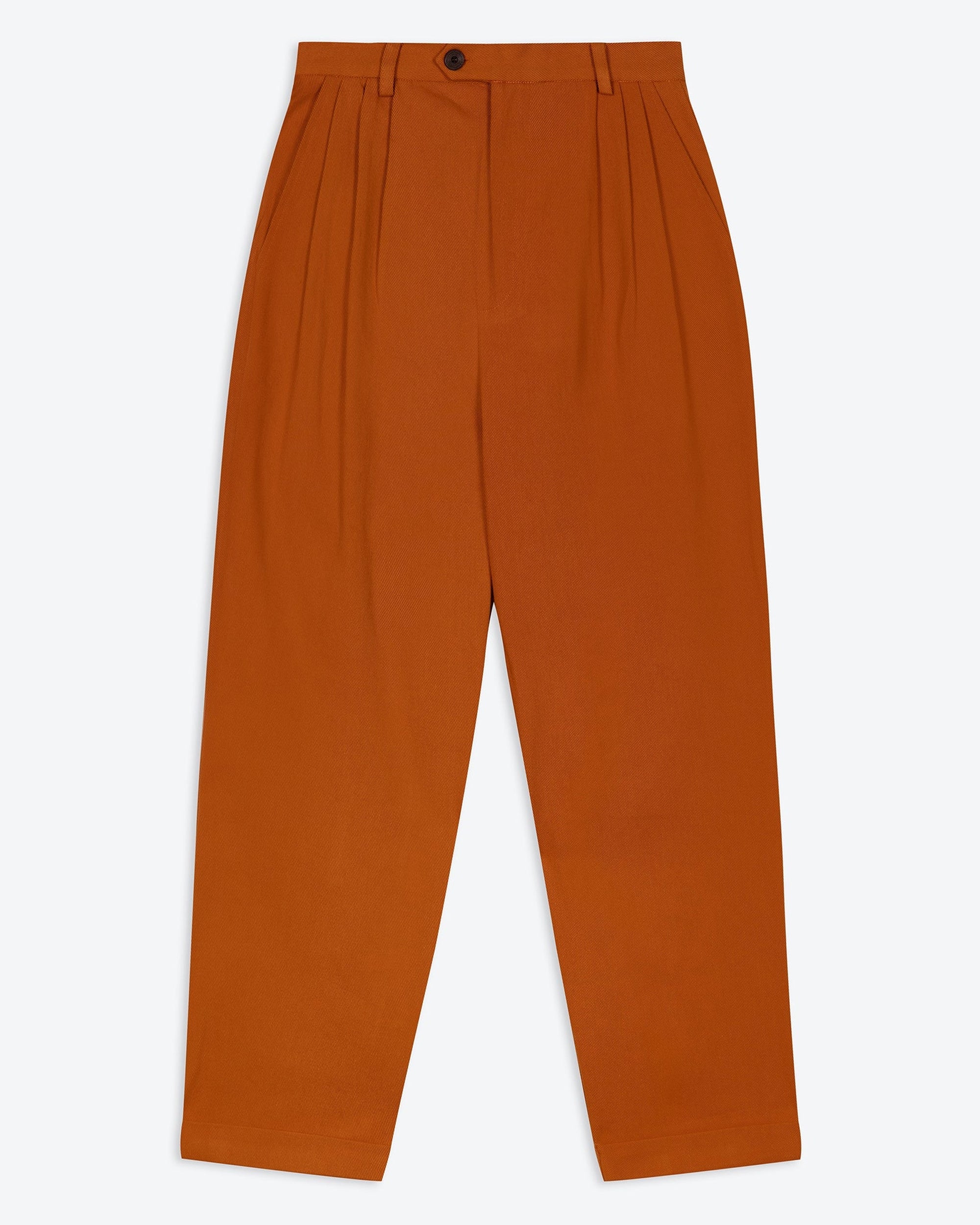 A pair of orange wide leg trousers with pleats and a fixed turn-up hem, made from cotton drill fabric.