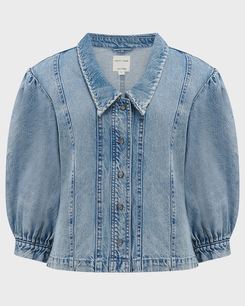 Light blue denim jacket on a white background