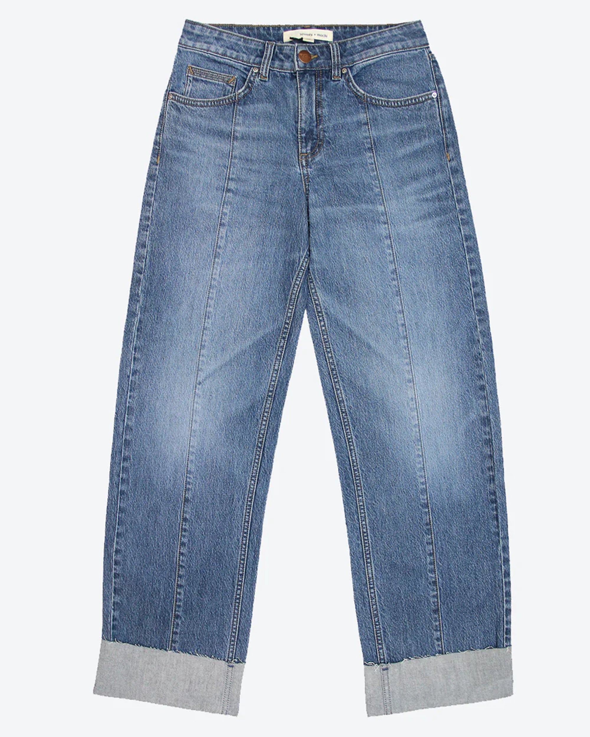 A pair of blue denim jeans with a frayed hem and a deep turn-up at the cuffs, featuring a straight leg cut and mid-rise waist.