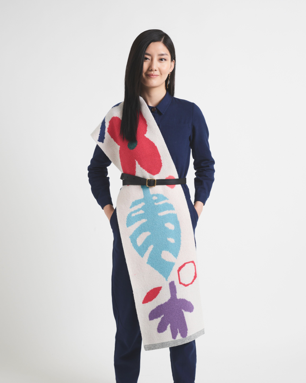 Person holding bright coloured scarf