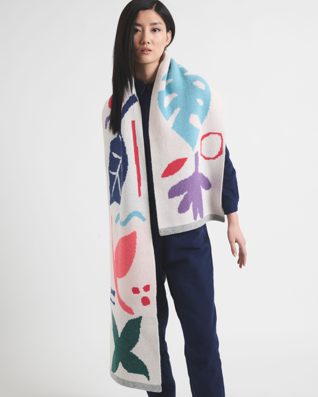 Person holding bright coloured scarf