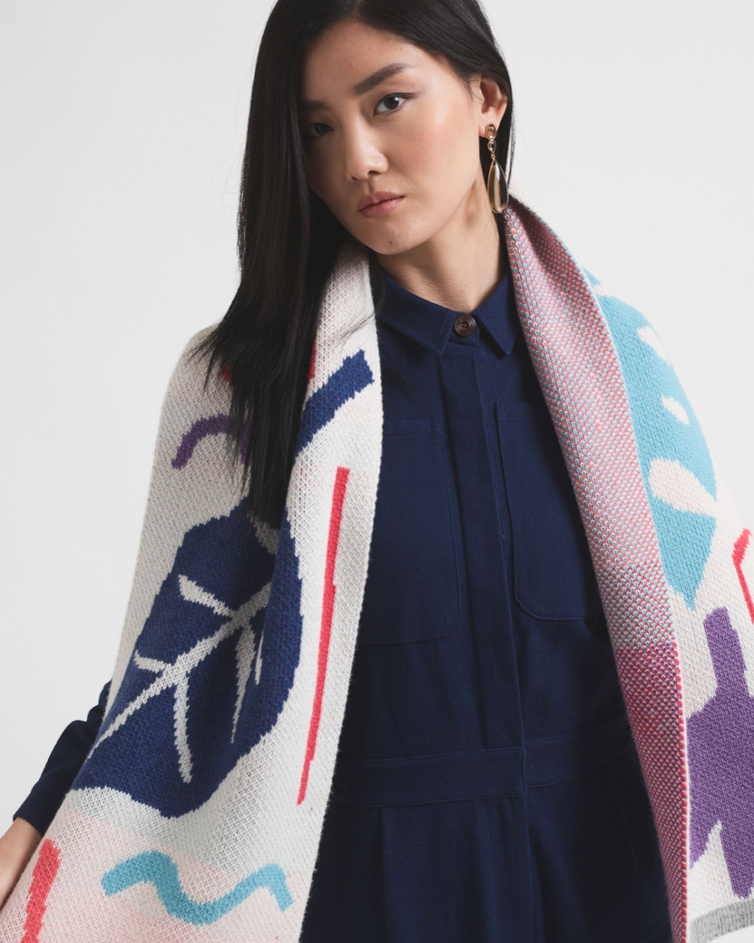 Person holding bright coloured scarf