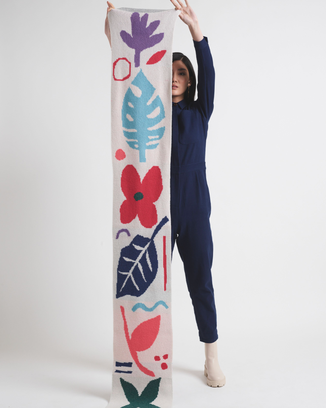 Person holding bright coloured scarf