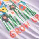 A relaxed fit purple T-shirt with a graphic of flowers and the text 'GROW UP' designed by Luke John Arnold.