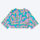 Colorful geometric patterned shirt on a white background