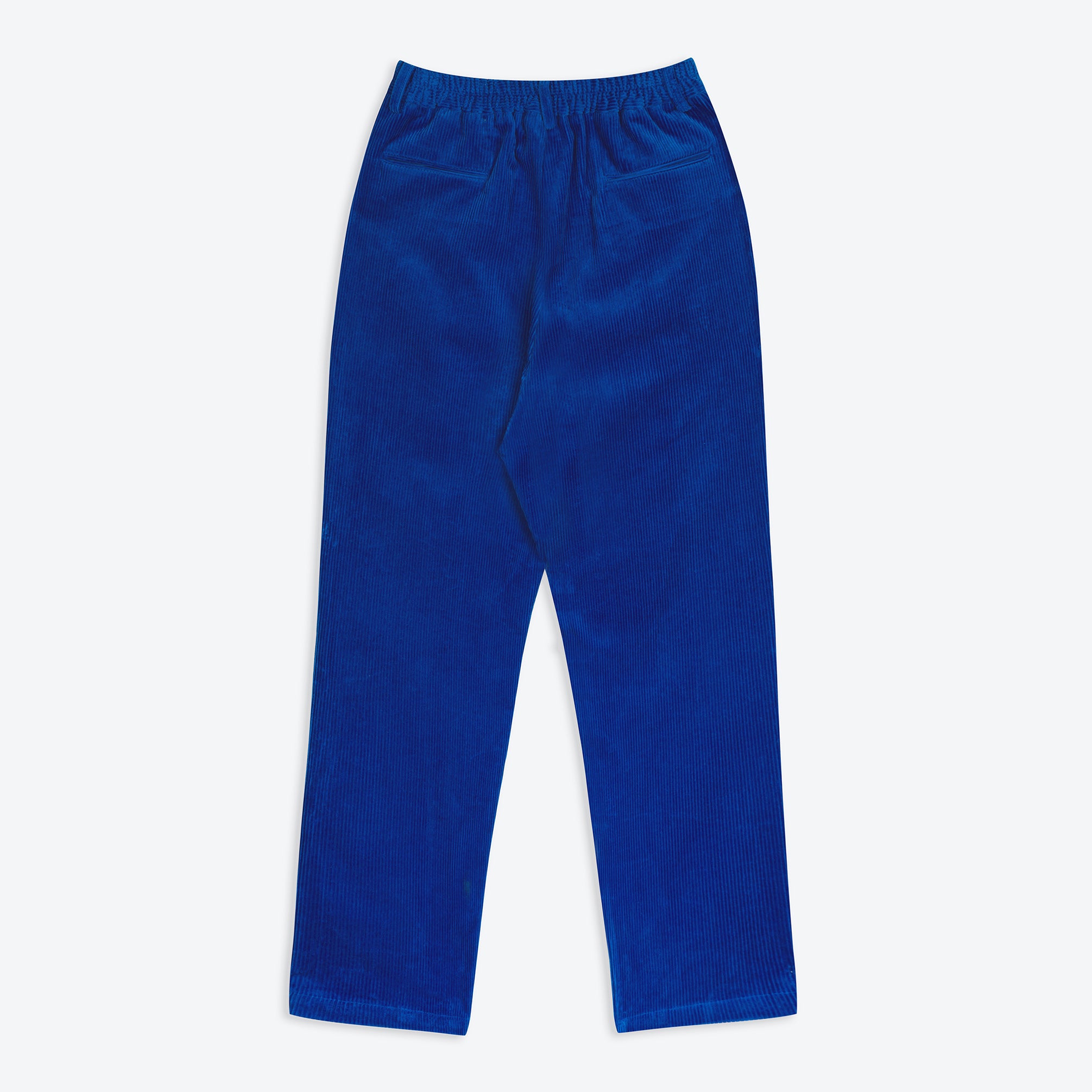 A pair of electric cobalt blue corduroy easy trousers with a 4-pocket design, belt loops, pleats, and a tapered leg.