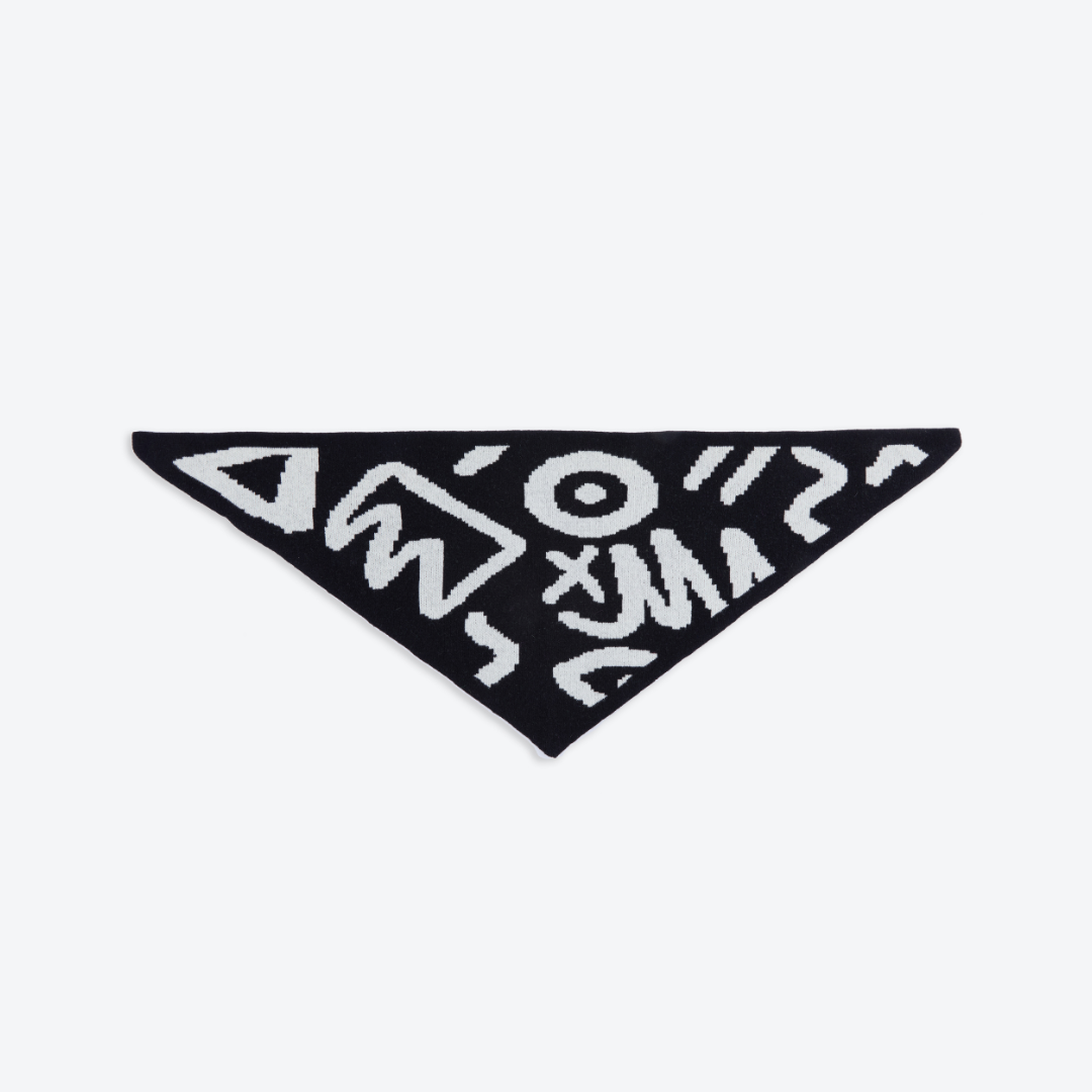 Black triangle-shaped patch with white geometric patterns on a white background