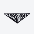 Black triangle-shaped patch with white geometric patterns on a white background