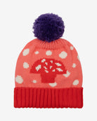 A pink beanie with a mushroom pattern and a purple pom-pom on top, with a red contrasting turn-up rim.