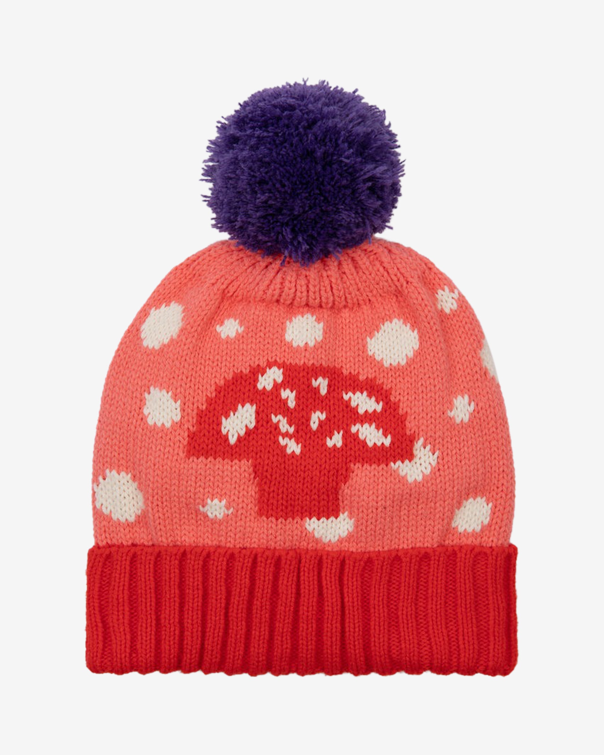 A pink beanie with a mushroom pattern and a purple pom-pom on top, with a red contrasting turn-up rim.
