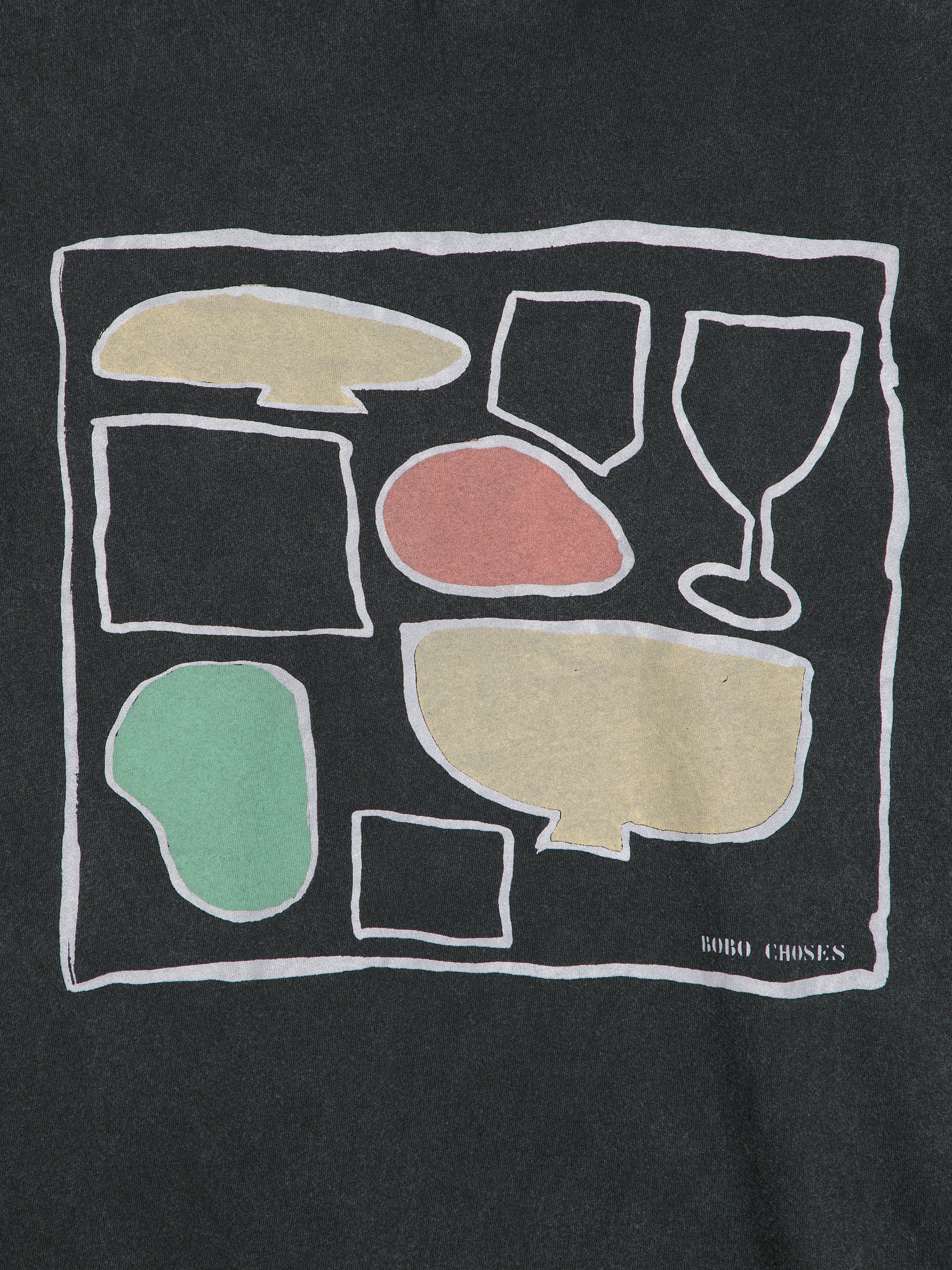 Black t-shirt with colorful abstract shapes and 'Bobby Chones' branding.