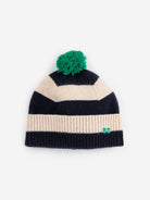 Striped beanie with a green pom-pom on a white background