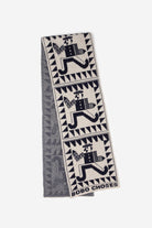 Textile with geometric patterns and 'Bobo Choses' branding on a white background