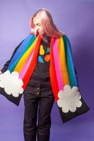 Person wearing a rainbow scarf
