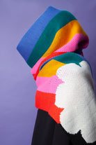 Person wearing a rainbow scarf