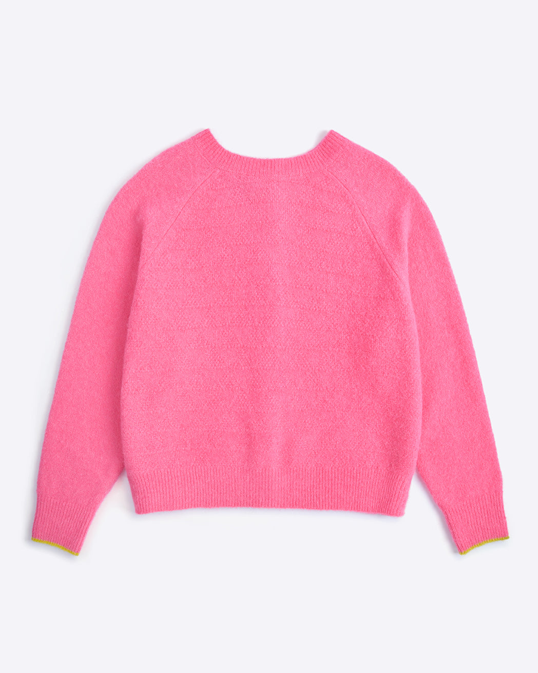Pink sweater on a light purple background