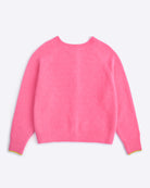 Pink sweater on a light purple background