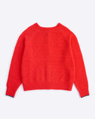 Red sweater on a light gray background
