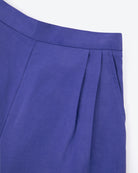 Close-up of a blue pleated fabric on a white background