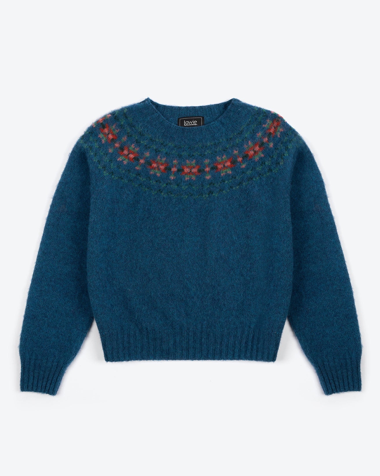 Blue sweater with red pattern on neckline against a white background