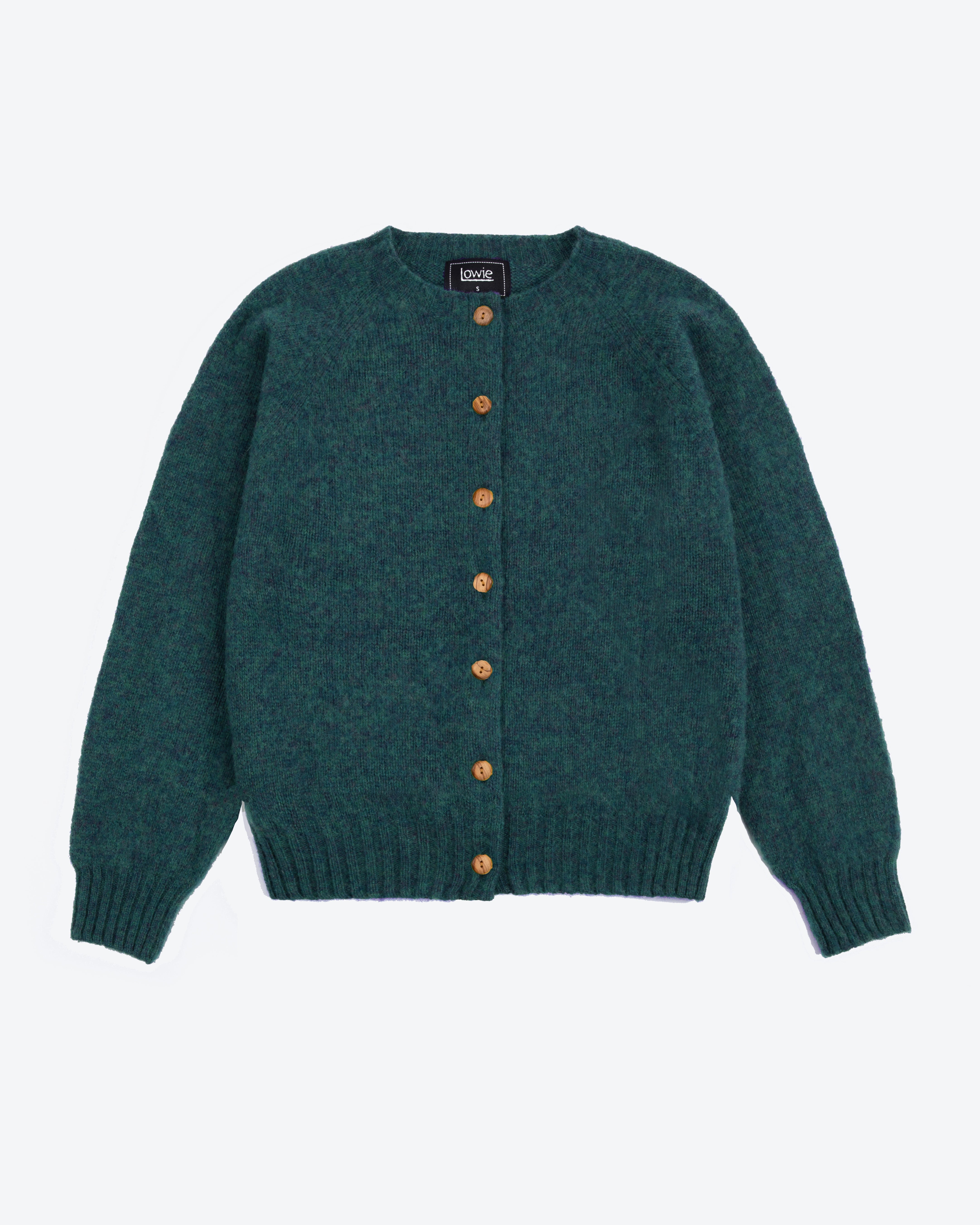 A dark teal green knit cardigan sweater with brown buttons, laid flat against a light gray background.