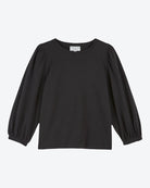 Black long-sleeve top on a light gray background
