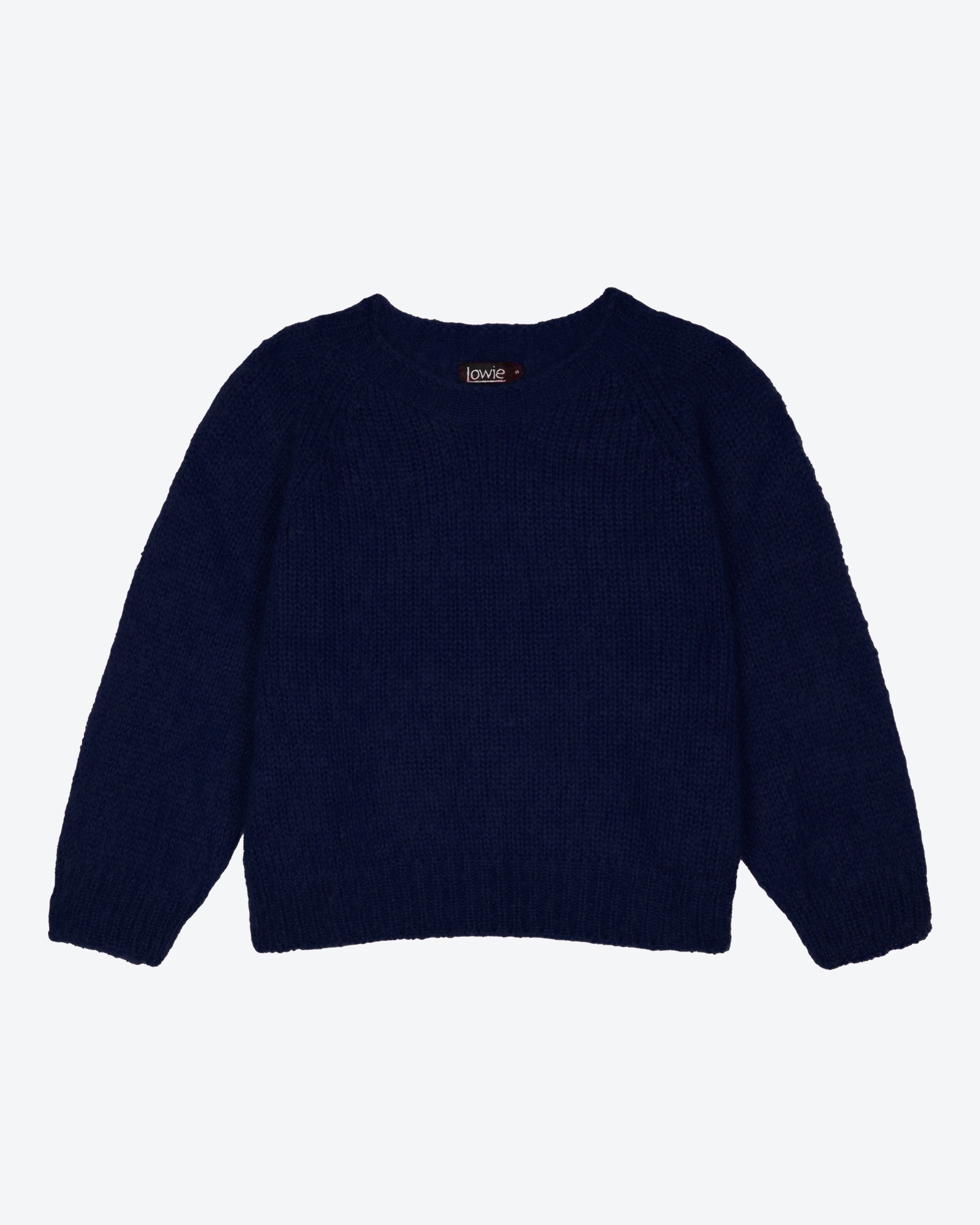 A navy blue mohair sweater with long sleeves and a round neckline laid flat on a plain background.