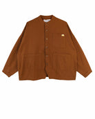 A brown utility jacket with a mandarin collar, button-up front, and four front pockets, laid flat against a white background.