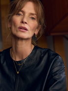 Woman wearing a black top with a blurred background