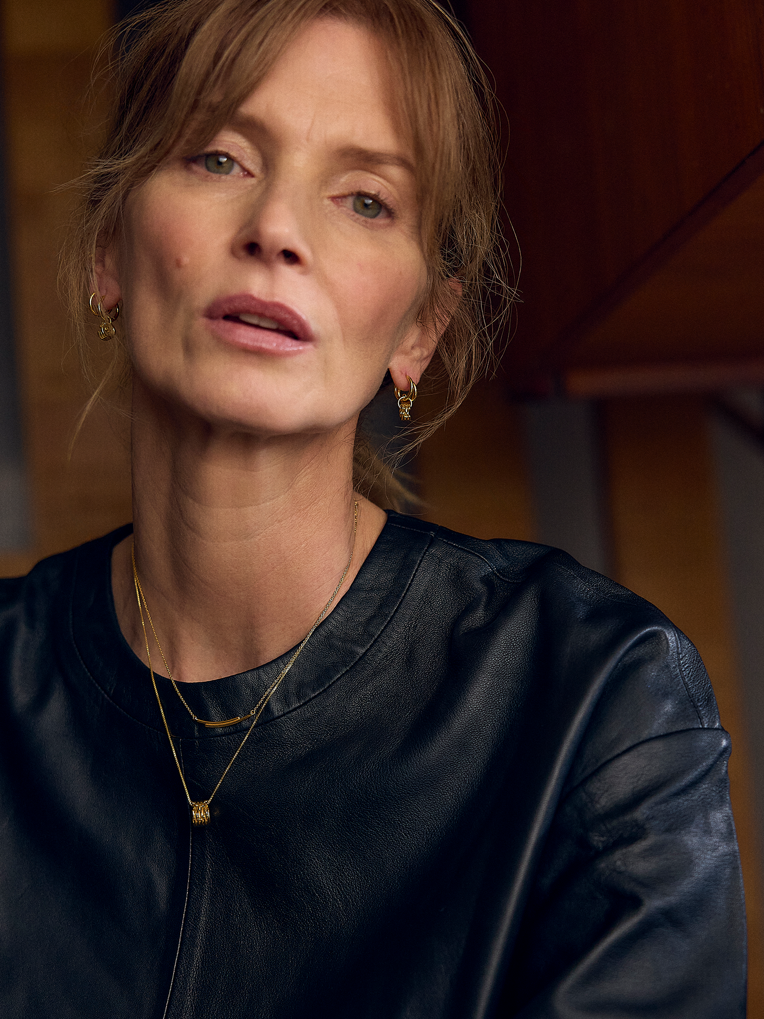 Woman wearing a black top with a blurred background